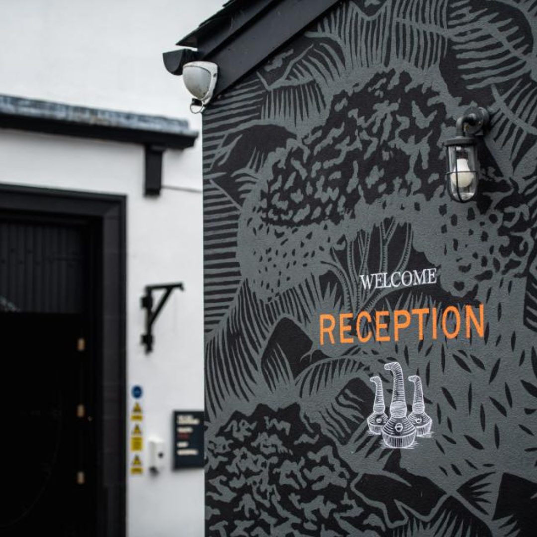 An external wall saying "Welcome Reception" on Glengoyne Disillery in Scotland