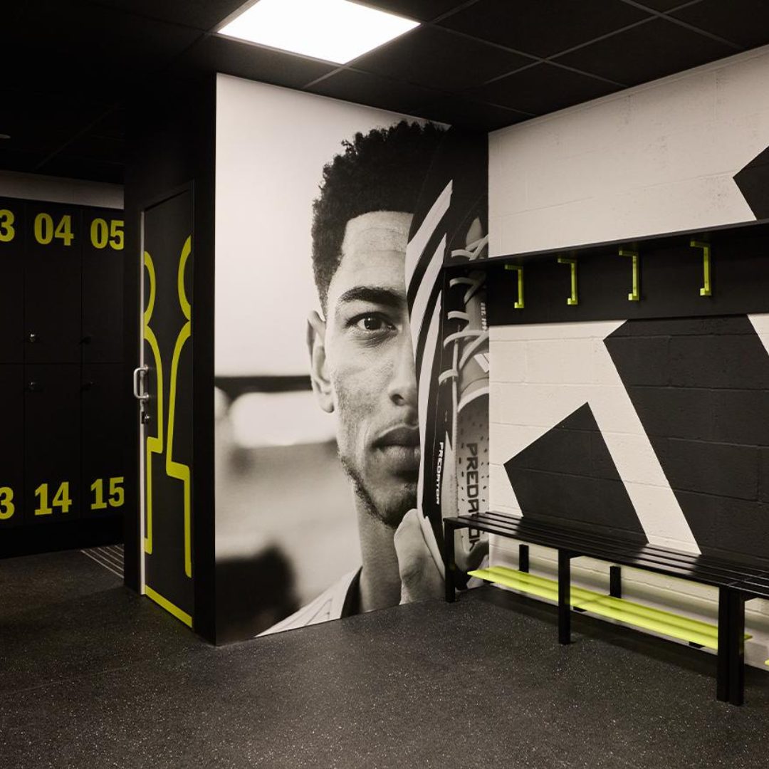 Changing room inside a community hub called #MerkyFC HQ